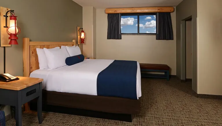 The king bed in the accessible Gray Wolf Suite 